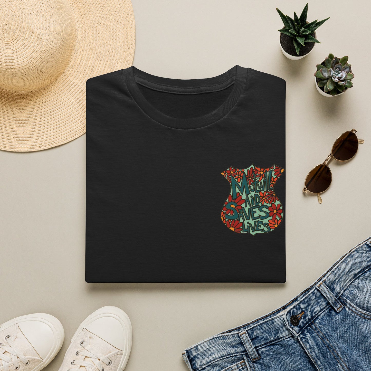 Vintage Floral Shield T‑Shirt — 'Mutual Aid Saves Lives' Pocket Graphic