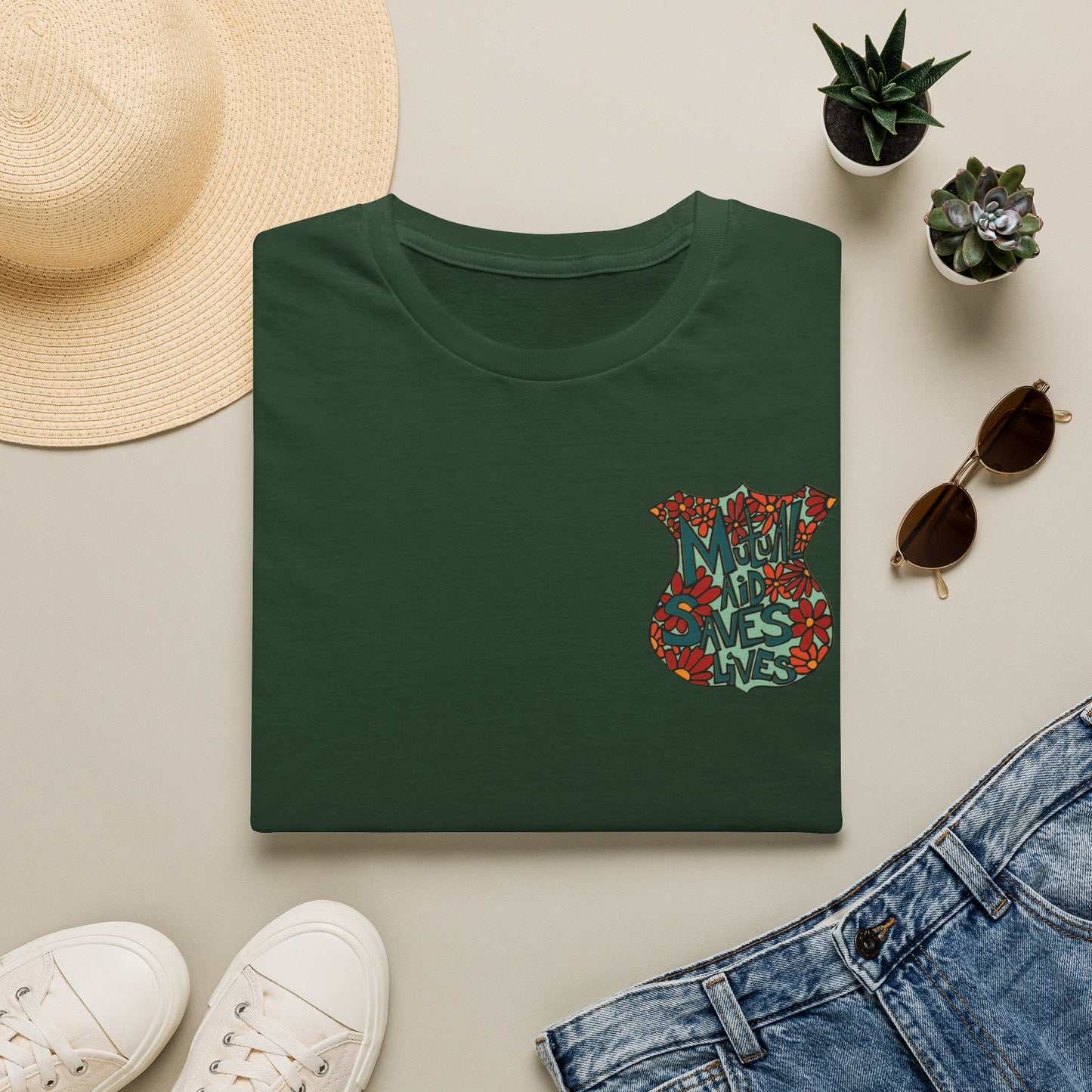 Vintage Floral Shield T‑Shirt — 'Mutual Aid Saves Lives' Pocket Graphic