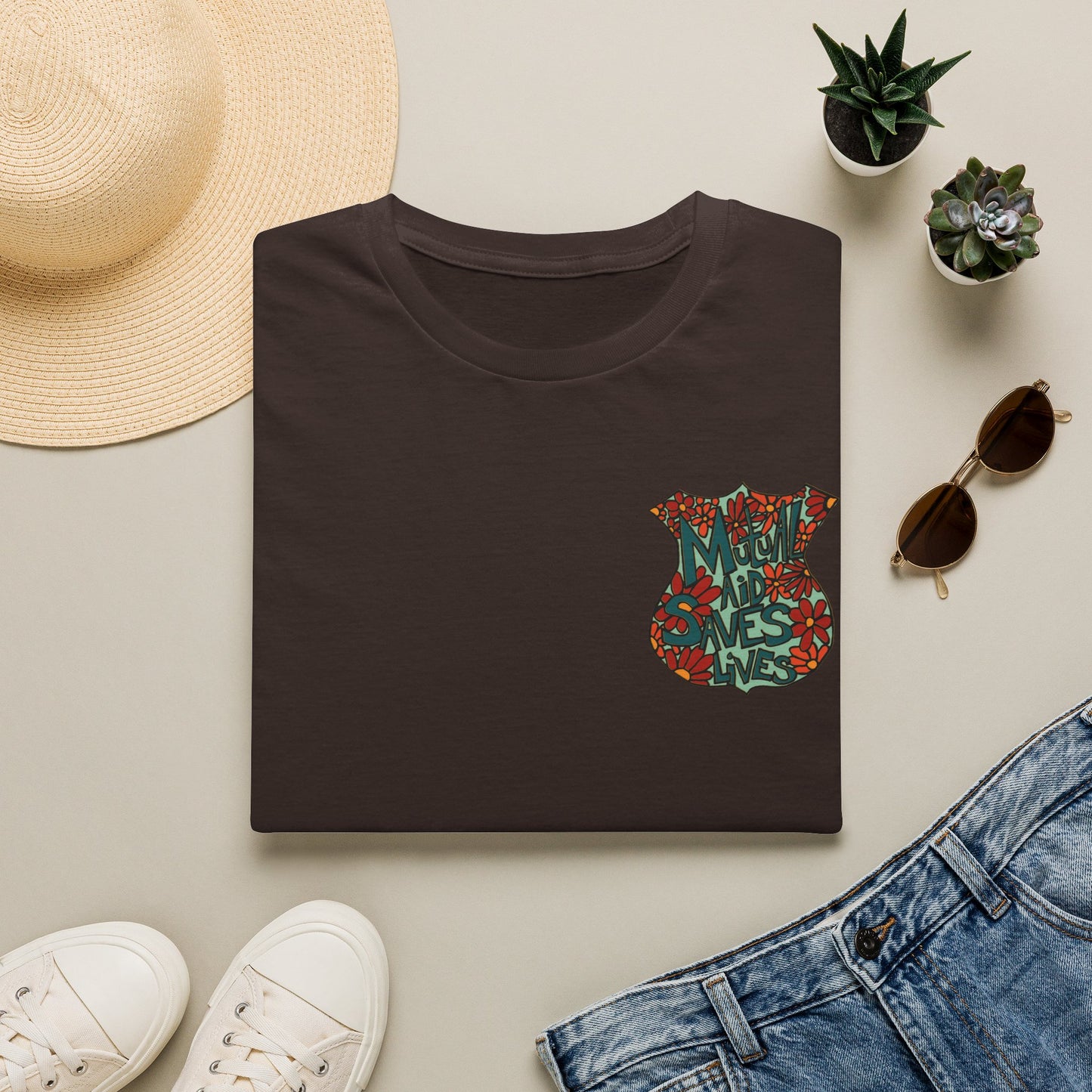 Vintage Floral Shield T‑Shirt — 'Mutual Aid Saves Lives' Pocket Graphic
