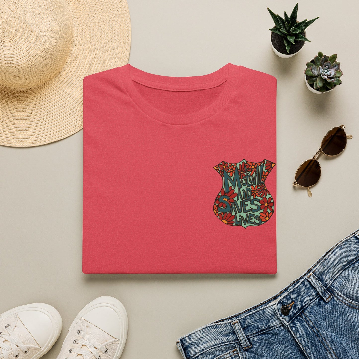 Vintage Floral Shield T‑Shirt — 'Mutual Aid Saves Lives' Pocket Graphic