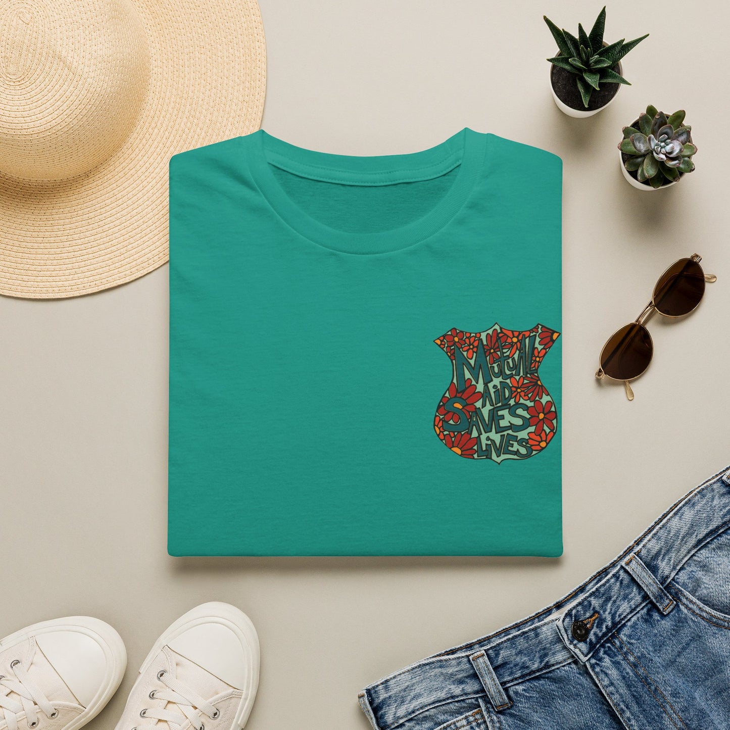 Vintage Floral Shield T‑Shirt — 'Mutual Aid Saves Lives' Pocket Graphic